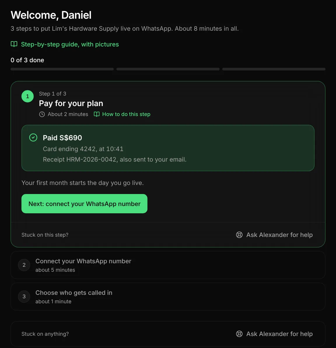 Step 1 is done. It says Paid S$690, card ending 4242, and the receipt number HRM-2026-0042, also sent to your email. Below is the button Next: connect your WhatsApp number.